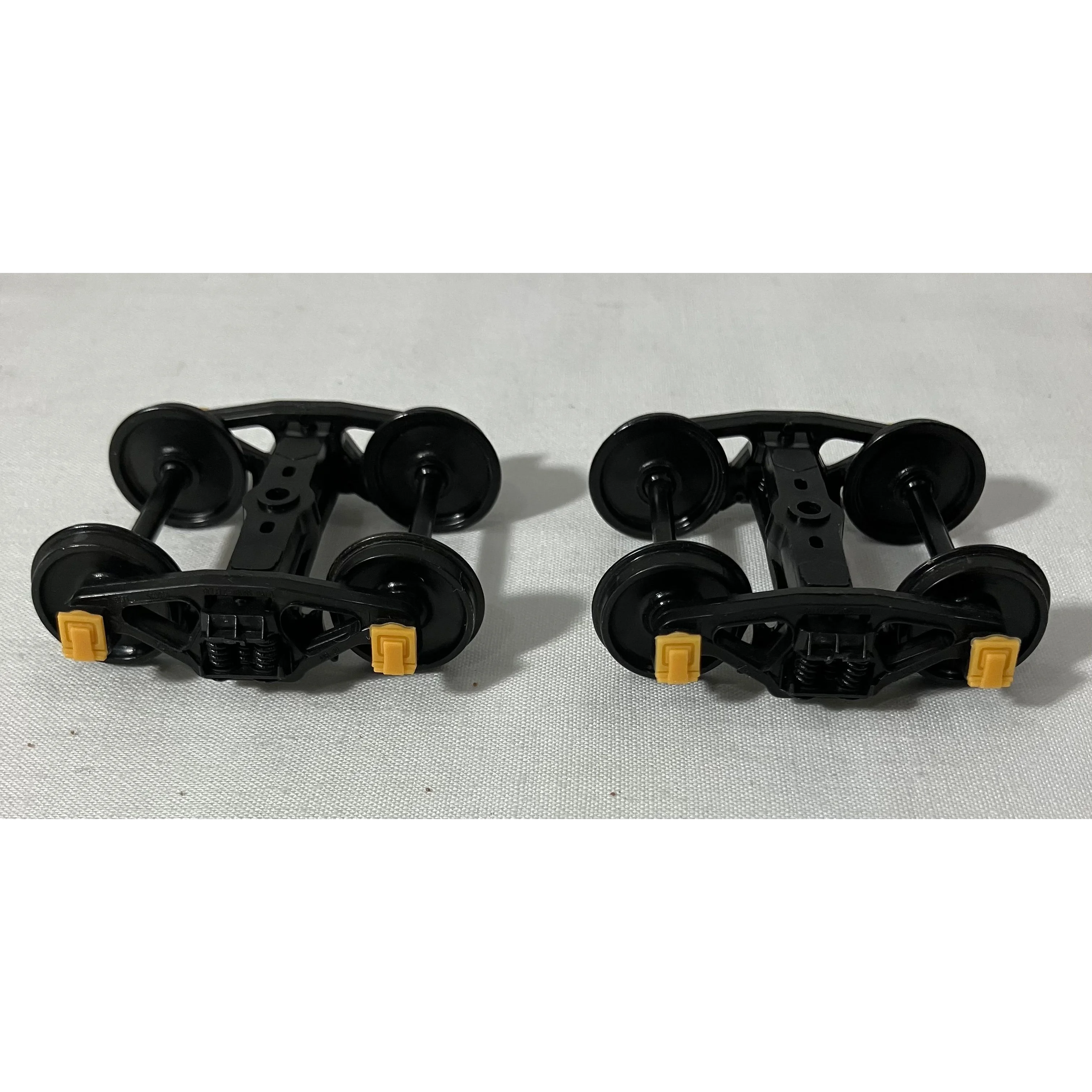 O scale two rail plastic trucks (pair)